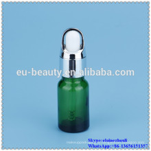 empty glass green dropper bottle with glass dropper